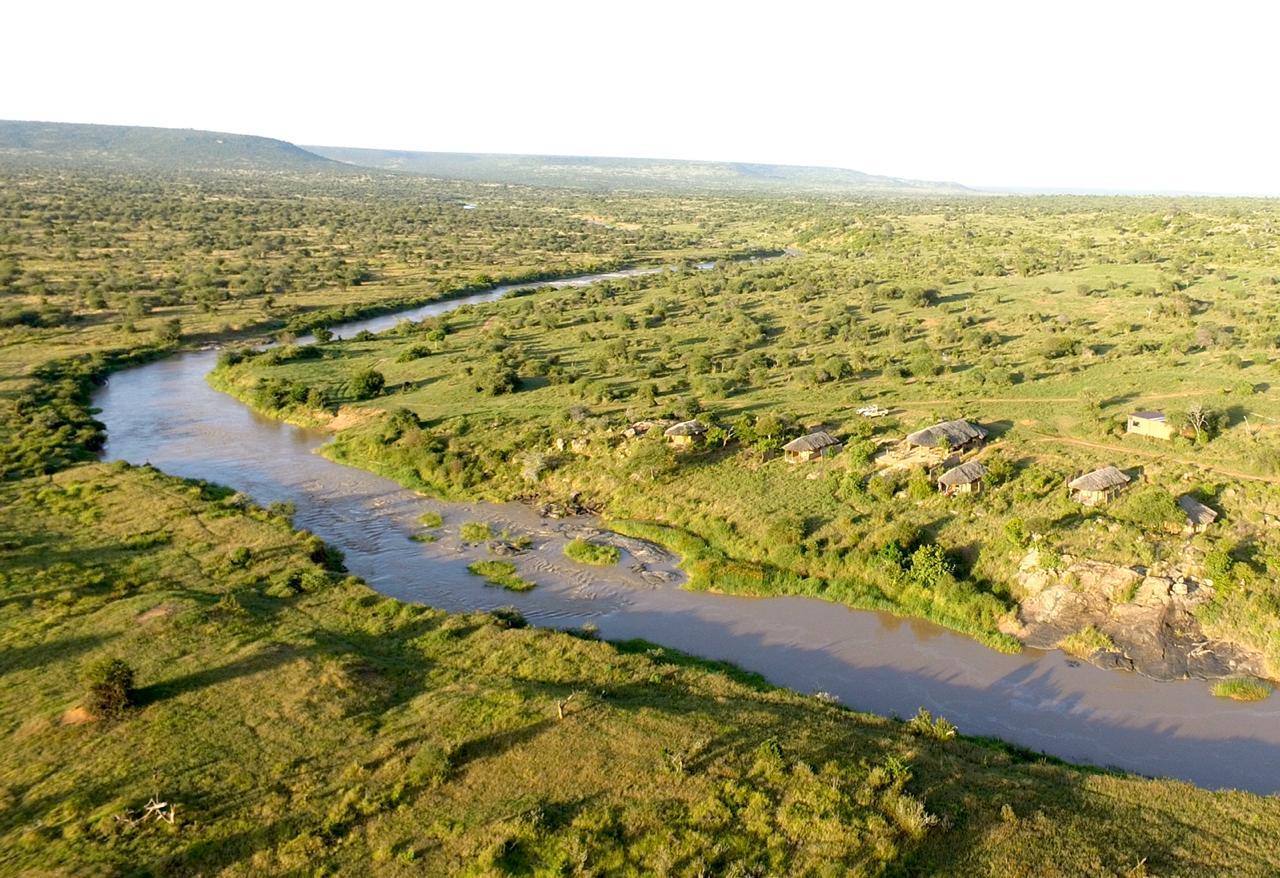 Laikipia plateau — river, savanna and camp in Kenya