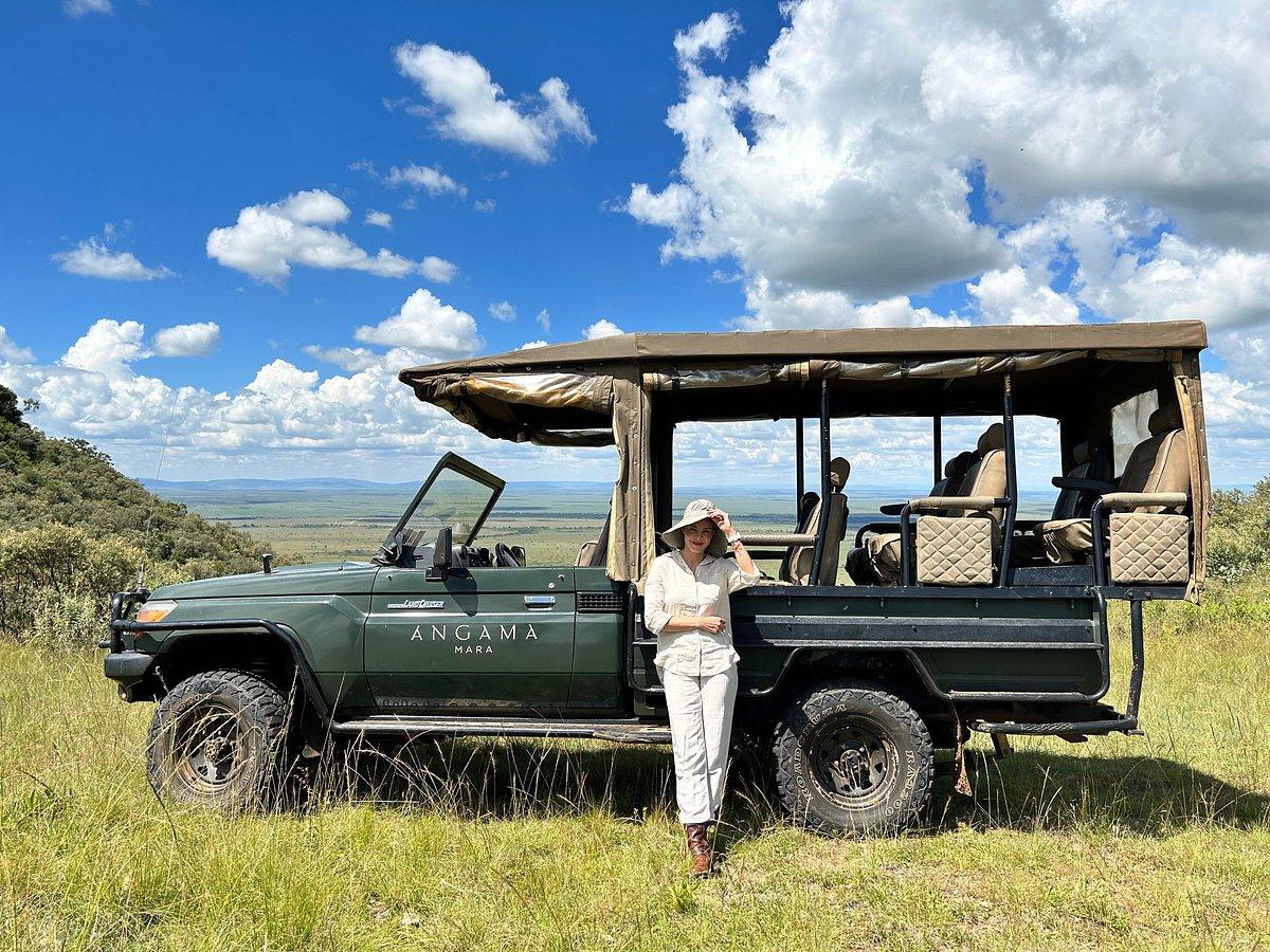 African safari vehicle with lions in the Maasai Mara